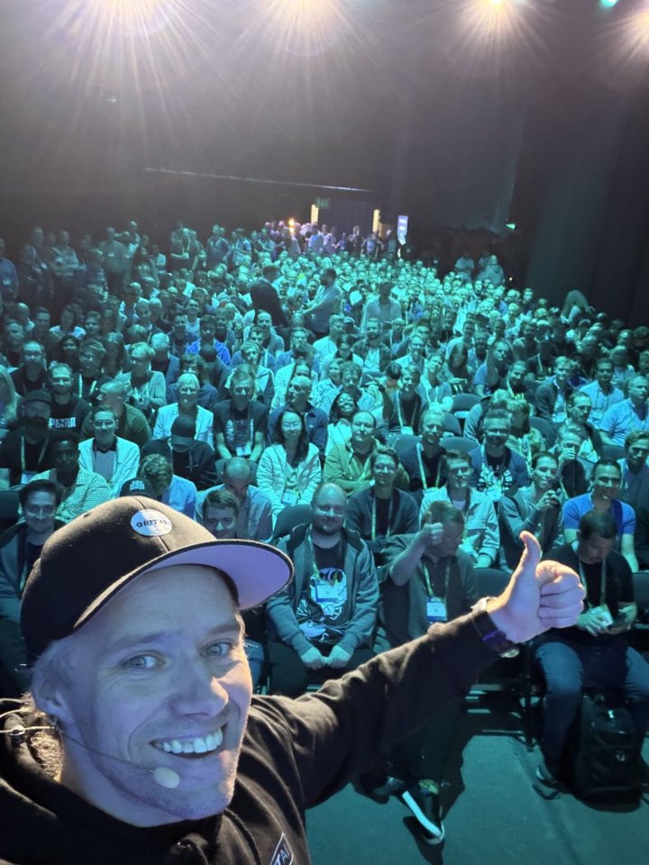 Daisy and Aleksander at NDC Oslo, and the room for his talk